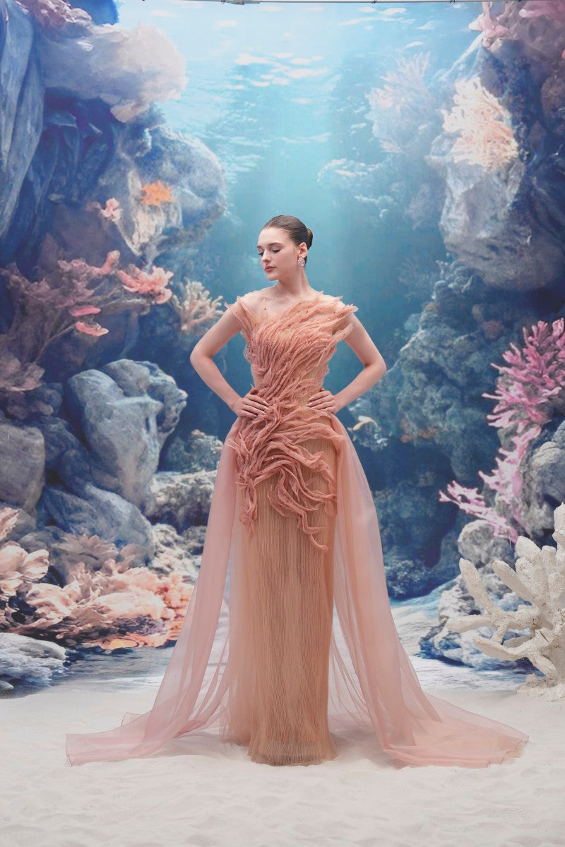 Light pink tulle and organza gown by 21Six, featuring a flowing design and delicate fabric for elegant formal occasions.