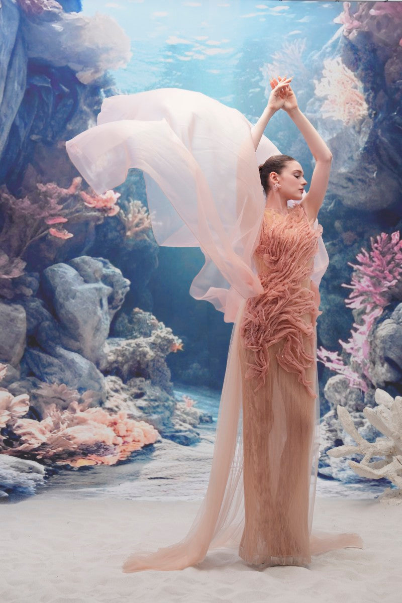 Light pink tulle and organza gown by 21Six, featuring a flowing, elegant design perfect for formal occasions.