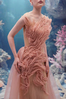 Light pink tulle and organza gown by 21Six, featuring delicate fabric details and elegant design for formal occasions.