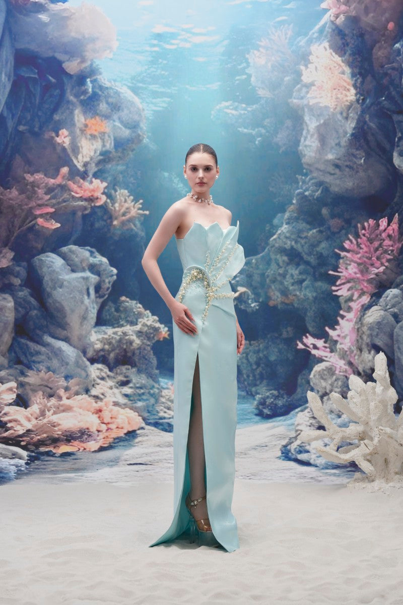 Light blue Sirena Water Silk Taffeta gown by 21Six, elegant evening dress with flowing fabric and detailed design.