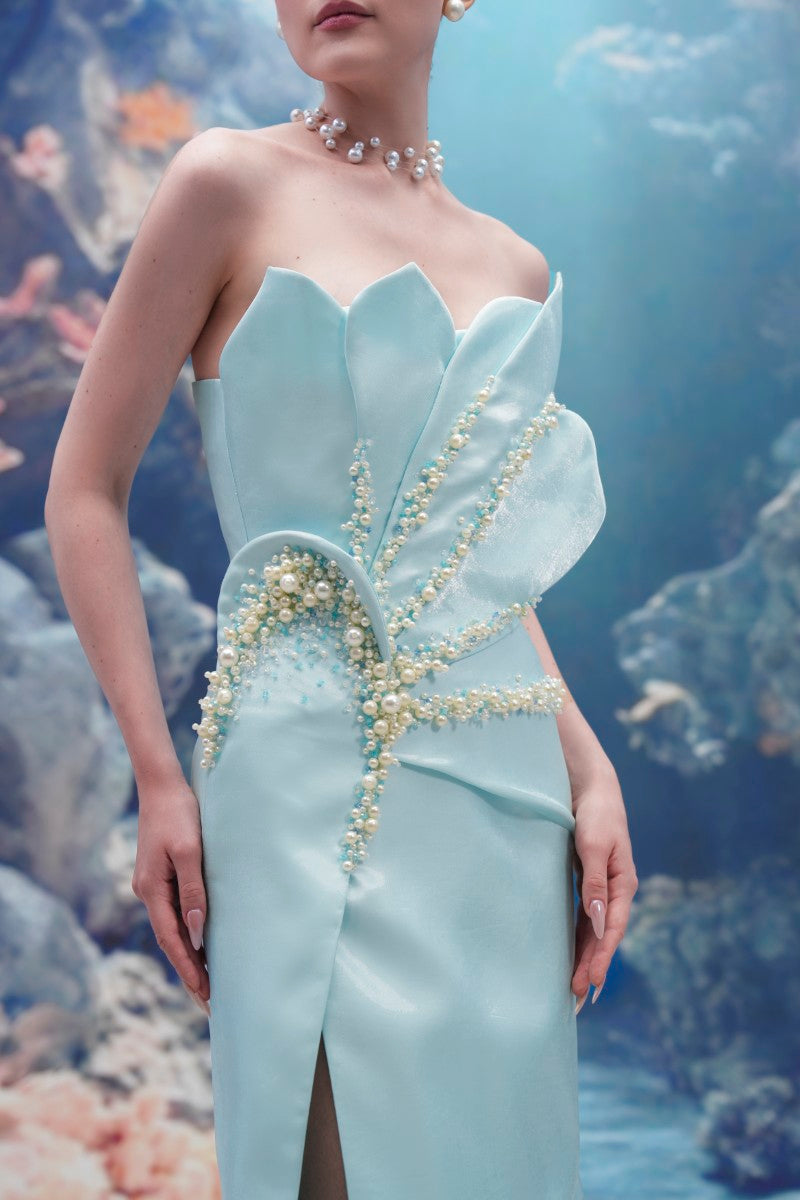 Light blue Sirena Water Silk Taffeta gown by 21Six, featuring elegant fabric and flowing design, shown on a model.