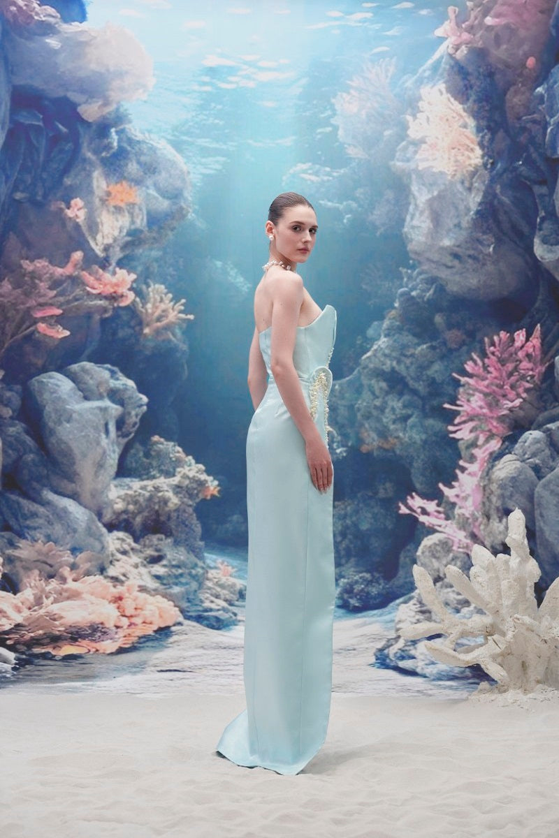 Light blue Sirena Water Silk Taffeta gown by 21Six, featuring elegant flowing fabric and a fitted silhouette.