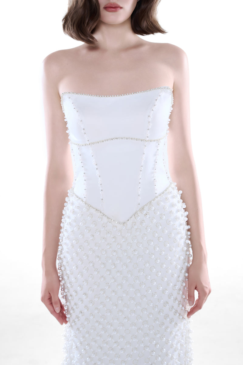Ivory Camellia Pearl Corset Gown by HACCHIC COUTURE, elegant maxi dress with intricate pearl details and fitted corset style.
