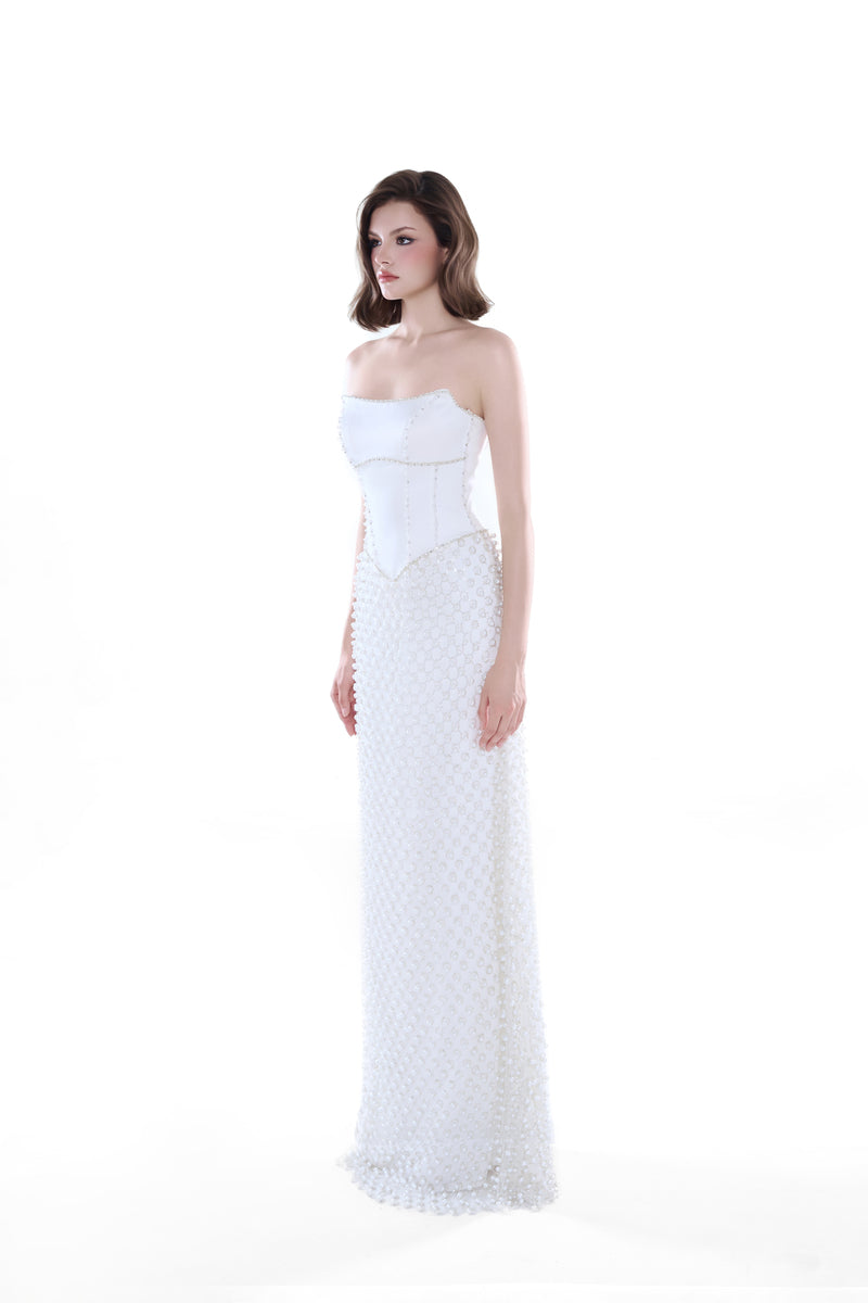 Elegant ivory Camellia Pearl corset gown by HACCHIC COUTURE, featuring intricate details and a flowing maxi dress silhouette.