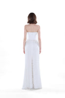 Ivory Camellia Pearl Corset Gown by HACCHIC COUTURE featuring intricate pearl detailing and elegant design.