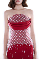 Crimson red Ruby Crystal corset gown by HACCHIC COUTURE featuring intricate crystal embellishments and a fitted silhouette.