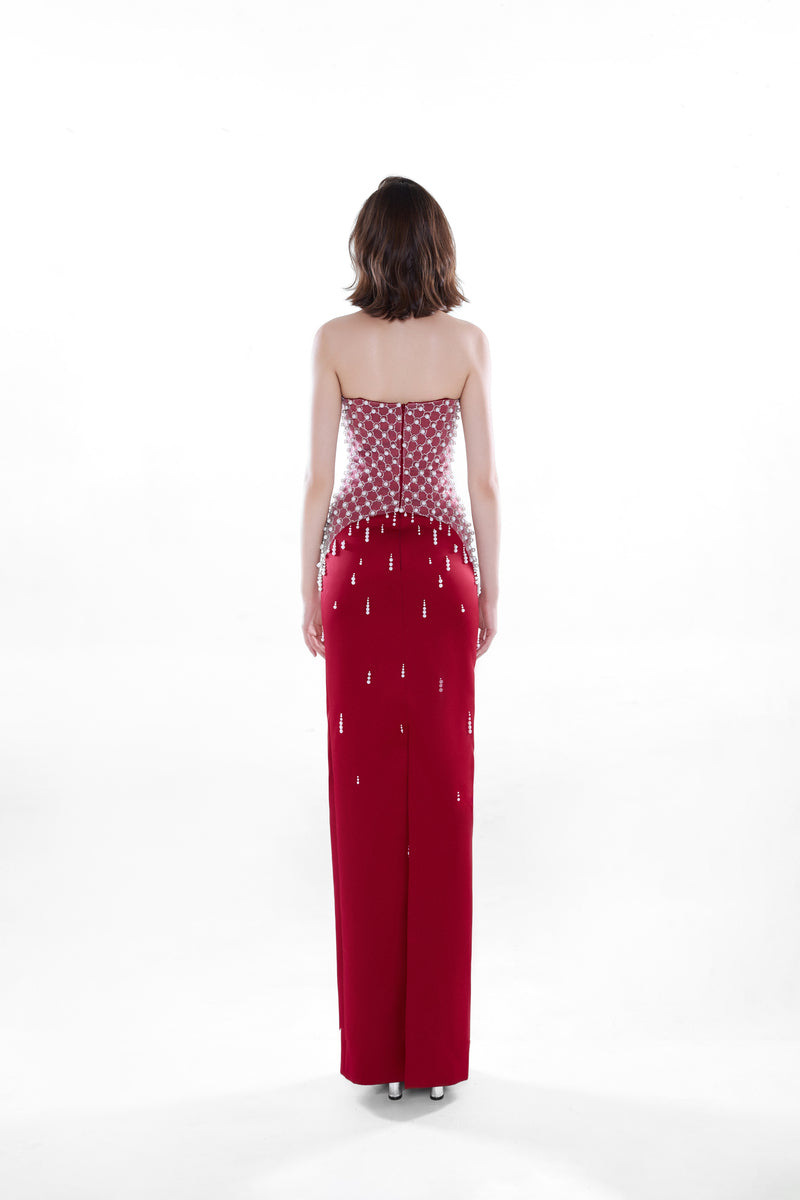 Crimson red Ruby Crystal corset gown by HACCHIC COUTURE, featuring intricate crystal embellishments and a flowing maxi dress silhouette.