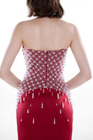 Crimson red Ruby Crystal corset gown by HACCHIC COUTURE featuring intricate crystal embellishments and elegant floor-length design.