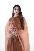 Hacchic Couture Aurora cape gown in cinnamon rose, elegant flowing gown with intricate details and soft fabric.