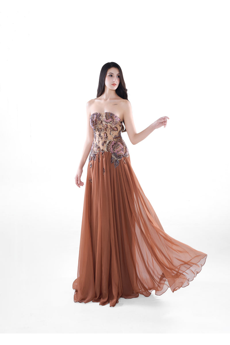 Elegant cinnamon rose maxi dress by HACCHIC COUTURE with intricate embellishments and flowing fabric, worn by a model.