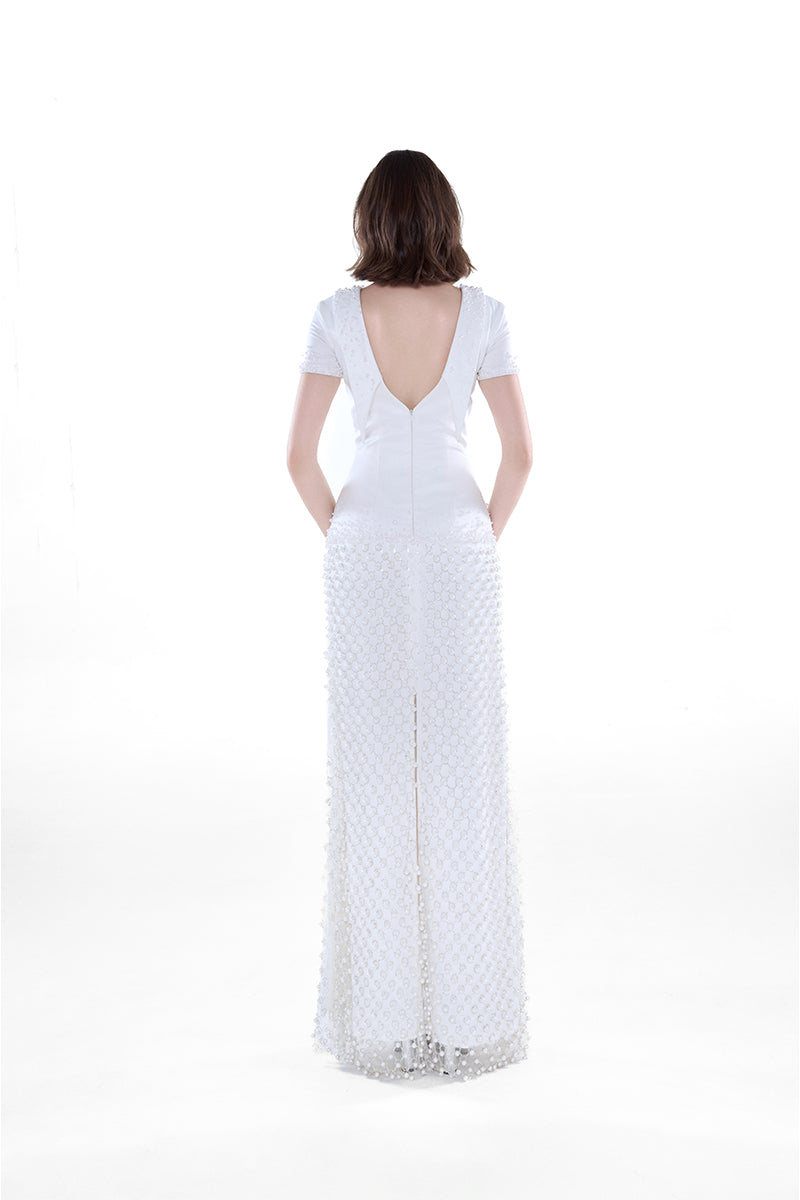 Elegant ivory Camellia Pearl Column Gown by HACCHIC COUTURE, featuring a flowing maxi dress with pearl details and a sleek silhouette.