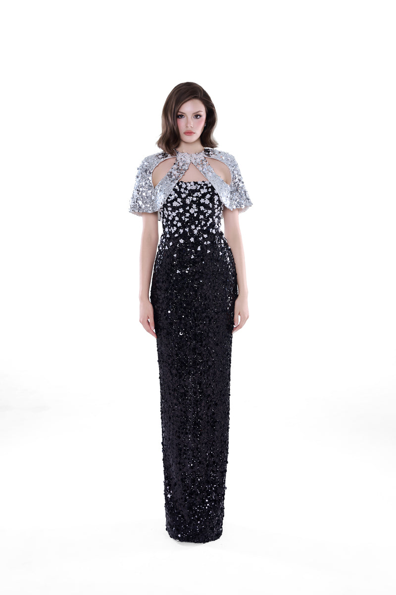 Black and silver Luna crystal cape gown by HACCHIC COUTURE, featuring a flowing maxi dress with intricate crystal embellishments.