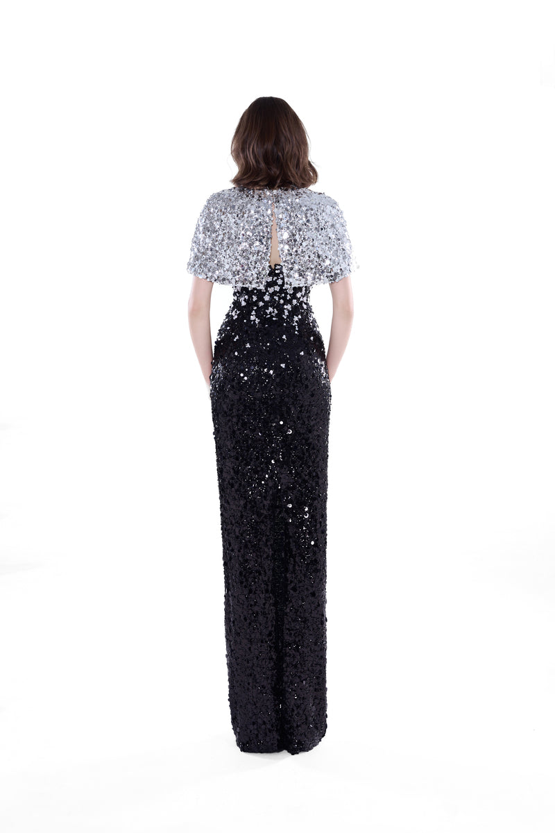 Black and silver Luna Crystal Cape Gown by HACCHIC COUTURE, featuring a flowing maxi dress with shimmering crystal accents.