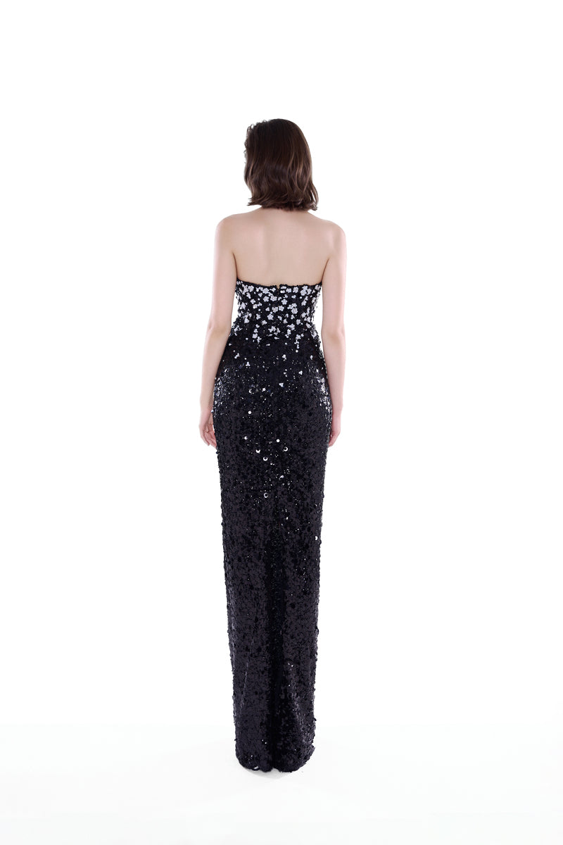 Black and silver Luna Crystal Cape Gown by HACCHIC COUTURE, featuring intricate crystal embellishments and a flowing maxi dress design.