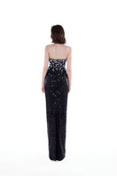 Black and silver Luna crystal cape gown by HACCHIC COUTURE featuring intricate crystal embellishments and flowing fabric.