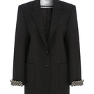 Hand embroidered longline jacket by TAGG, featuring intricate embroidery and a relaxed fit, shown on a model.