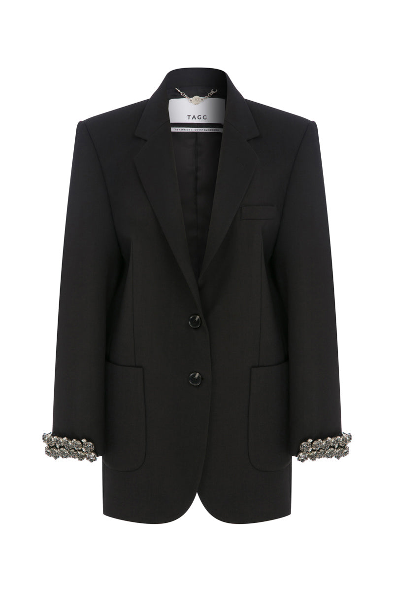 Hand embroidered longline jacket by TAGG, featuring intricate embroidery and a relaxed fit, shown on a model.