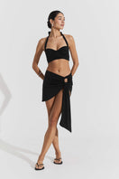 Seaquelle Haven mini skirt in pearl black, stylish cover-up with a sleek fit, featuring a smooth fabric and modern design.