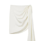 Seaquelle Haven mini skirt in pearl white, a stylish cover-up with a fitted design and soft fabric for beach or poolside wear.