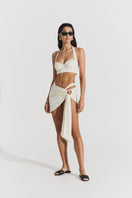 Seaquelle Haven mini skirt in pearl white, a stylish cover-up with a sleek, fitted design perfect for beach or poolside wear.