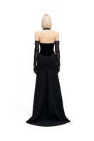 Black HAZAL gown by MOON / HAKAAN YILDIRIM, featuring elegant fabric and detailed design, displayed on a mannequin.