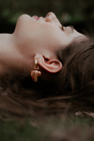 Sara & Flora terracotta perfume hoop earrings featuring stylish, handcrafted hoop earrings with a warm terracotta finish.