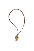 Sara & Flora terracotta perfume necklace featuring a small, round pendant on a delicate chain, stylish and lightweight accessory.