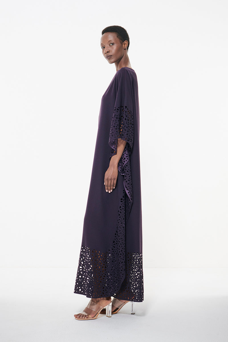 Dark purple laser cut maxi kaftan dress by Leem, featuring intricate laser cut details and a flowing, elegant design.