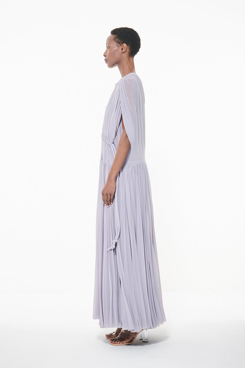 Leem dust lavender pleated waist maxi dress with marked waistband, flowing fabric, and elegant silhouette.