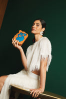 Sy&Vie Habitat Flying Birds clutch featuring a vibrant bird design, perfect for stylish accessories and evening events.