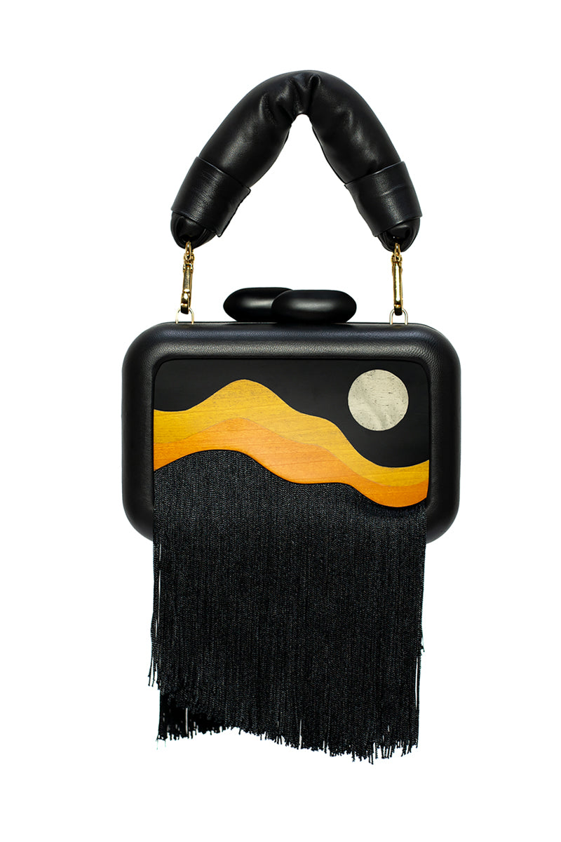 Sy&Vie Habitat Full Moon clutch bag with textured moon design and sleek black finish, stylish accessory for evening outfits.