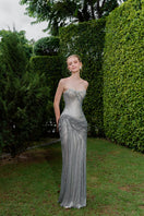 Elegant Celestia Crystal Draped Gown by HACCHIC COUTURE, featuring shimmering crystal embellishments and flowing fabric.