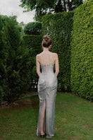 Elegant Celestia Crystal Draped Gown by HACCHIC COUTURE featuring intricate crystal embellishments and flowing fabric.