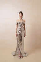 Silver couture gown by HACCHIC COUTURE featuring elegant fabric and intricate design details, perfect for formal occasions.
