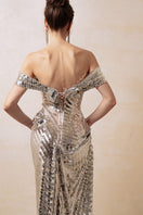Silver couture gown by HACCHIC COUTURE featuring elegant draping and intricate details, perfect for formal occasions.
