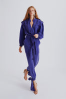 Purple Haleia jumpsuit with a matching belt, featuring a stylish, fitted design and wide-leg pants for a modern, chic look.