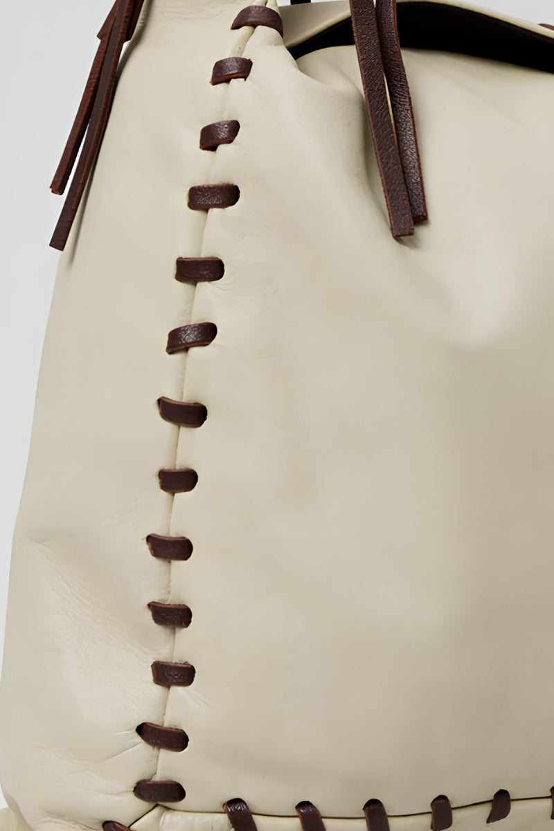Double A Halo leather shoulder bag in butter yellow, featuring a sleek design and adjustable strap, stylish for everyday use.