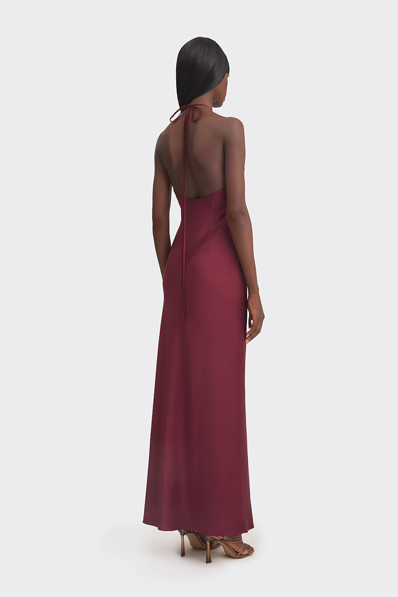 Stolen Stores CULT MIA X Stolen Stores burgundy halter bias maxi dress with a flowing slip design and sleeveless style.