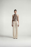 Brown halter sequin top by Tayfun Kaba featuring shimmering sequins and a stylish halter neckline for a chic look.