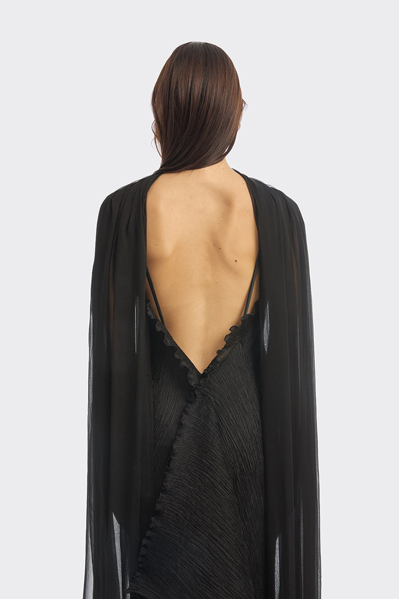 Black twisted pleat midi dress by Stolen Stores featuring hand-pleated design and elegant midi length.