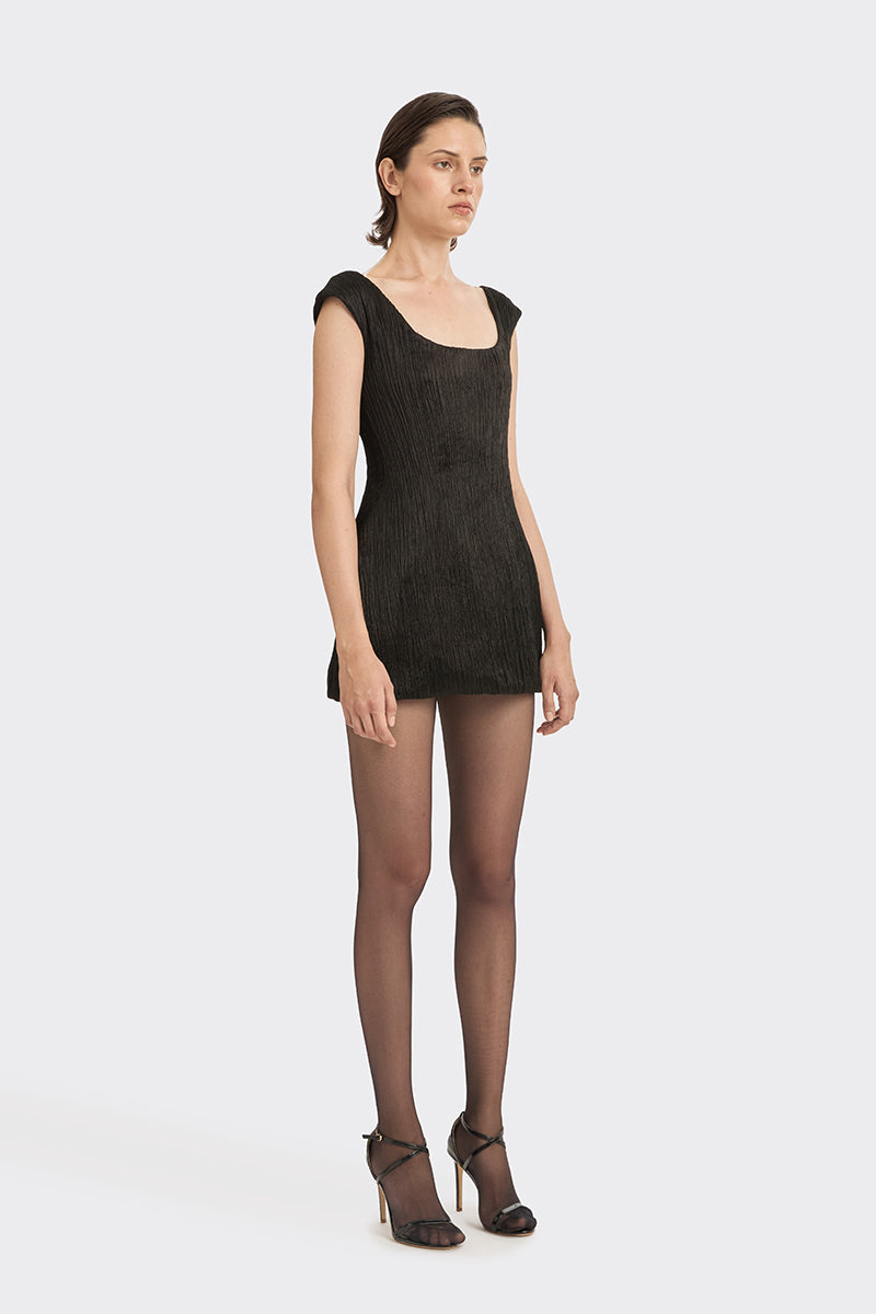 Black hand-pleated mini dress from Stolen Stores, showcasing the stylish fabric and detailed pleats on a sleek mini dress.