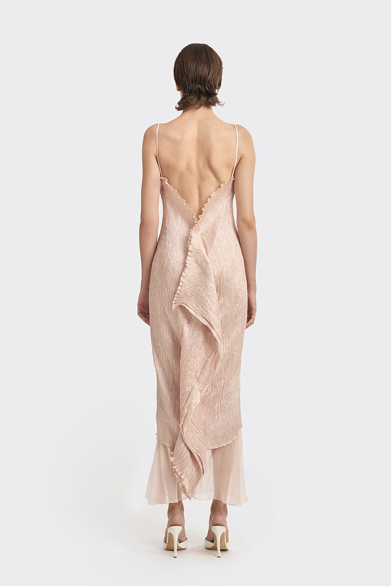 Light pink twisted pleat midi dress by Stolen Stores, featuring elegant hand-pleated fabric and a stylish midi length.