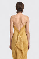 Gold hand-pleated midi dress by Stolen Stores, showcasing flowing fabric and elegant design, worn by a model.