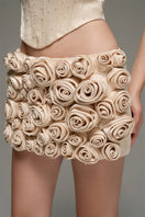 Beige corset top and embroidered skirt co-ords by I.H.F Studio, featuring a handmade rolled rose mini skirt with intricate embroidery.