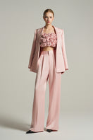 Light pink double-breasted blazer from I.H.F Studio, tailored fit with classic lapels, shown on a mannequin.