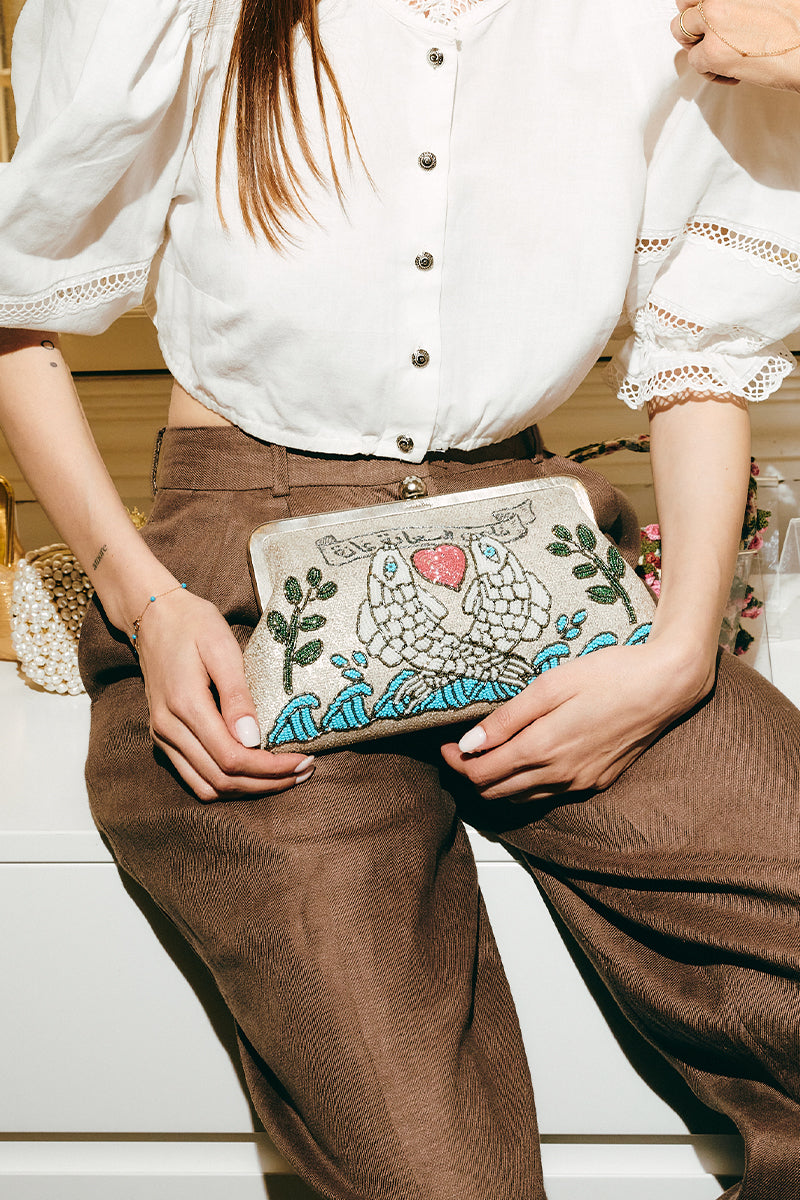 Multicolor Happiness Fish Classic clutch bag by Sarah's Bag, featuring vibrant fish design and elegant craftsmanship.
