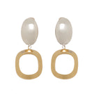 Silver and gold earrings named Hazel by Silvia Gnecchi featuring elegant, modern design with intricate details.