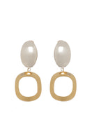 Silver and gold earrings named Hazel by Silvia Gnecchi featuring elegant, modern design with intricate details.