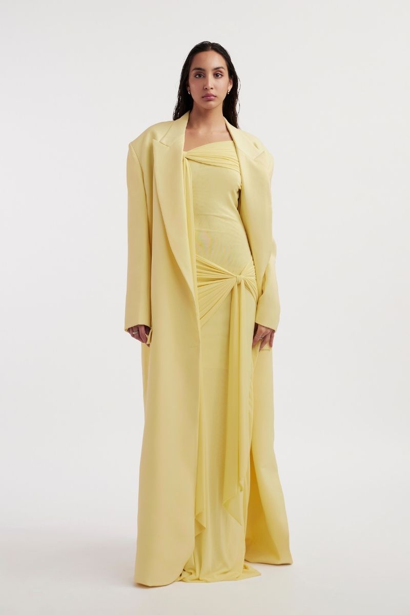 Deme By Gabriella Heloise Butter Yellow Jacket with long sleeves and front pockets, stylish and vibrant outerwear.