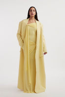 Deme By Gabriella Heloise Butter Yellow Jacket with long sleeves and stylish collar, displayed on a hanger.